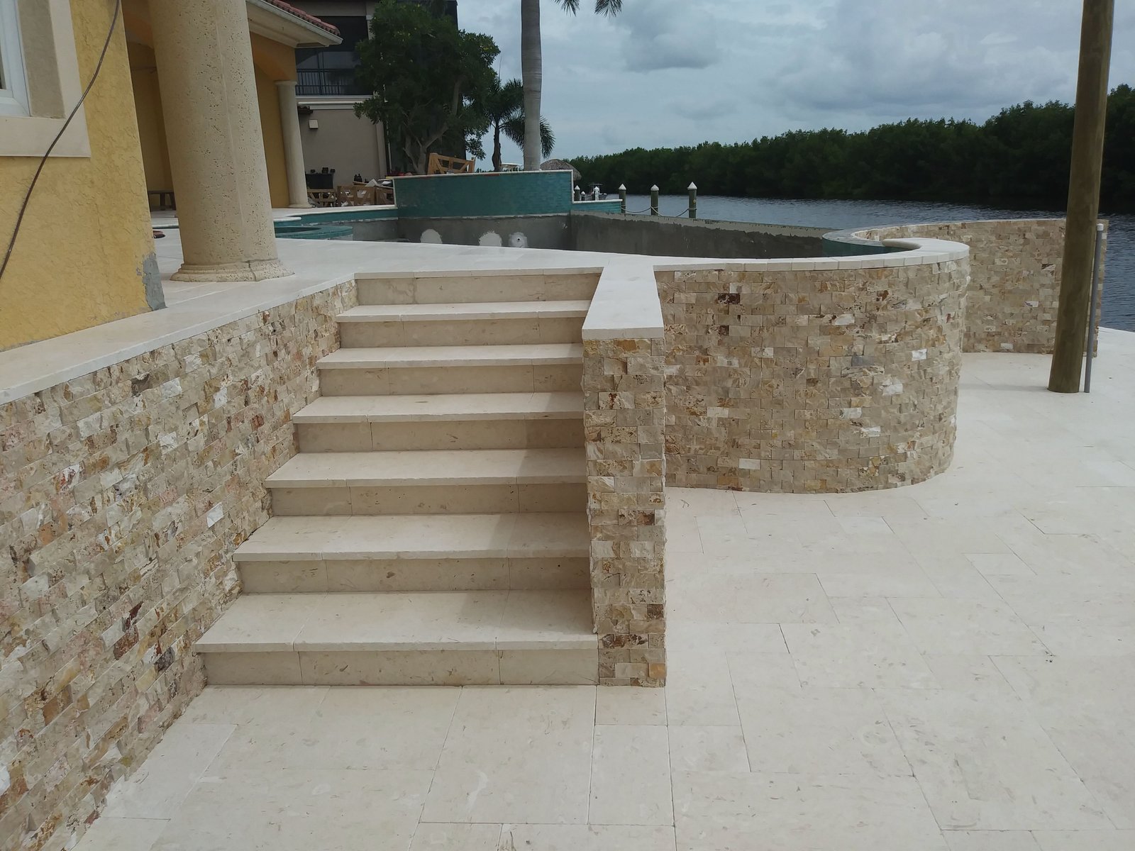 Travertine steps and pool coping installation